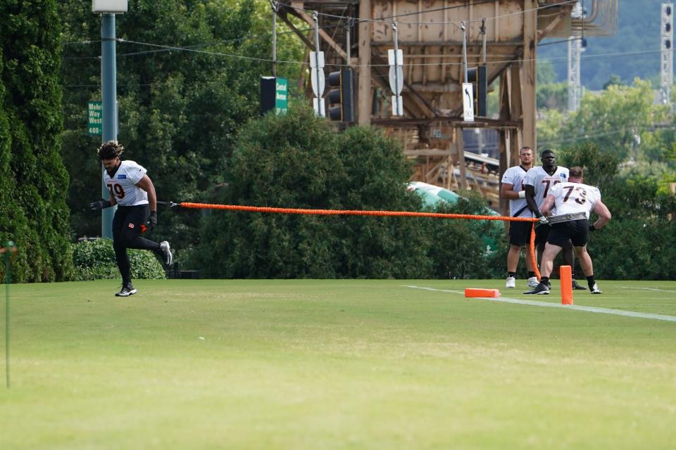 Cincinnati Bengals guard Jackson Carman (79), left, and Cincinnati Bengals offensive tackle Jonah Williams (73), right, participate in drills during Cincinnati Bengals training camp practice, Friday, July 29, 2022, at the practice fields next to Paul Brown Stadium in Cincinnati. 