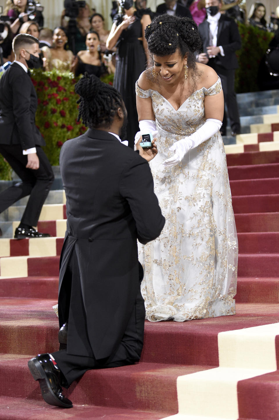 Former New York State Assembly candidate Bobby Digi Olisa, left, proposes to Laurie Cumbo, Commissioner of New York City Department of Cultural Affairs, at The Metropolitan Museum of Art's Costume Institute benefit gala celebrating the opening of the "In America: An Anthology of Fashion" exhibition on Monday, May 2, 2022, in New York. (Photo by Evan Agostini/Invision/AP)