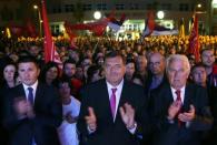 Milorad Dodik (C), President of Republika Srpska, celebrate the results of a referendum over a disputed national holiday during an election rally in Pale, Bosnia and Herzegovina, September 25, 2016. REUTERS/Dado Ruvic