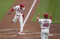 St. Louis Cardinals' Harrison Bader (48) celebrates as teammate Edmundo Sosa (63) scores during the second inning of a baseball game against the Pittsburgh Pirates Tuesday, May 18, 2021, in St. Louis. (AP Photo/Jeff Roberson)