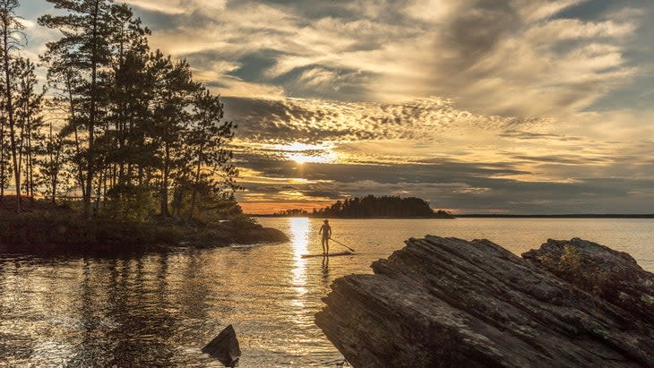 <span class="article__caption">Sunset paddleboarding, Crane Lake, Voyageurs National Park, Minnesota </span>(Photo: Per Breiehagen/Getty)