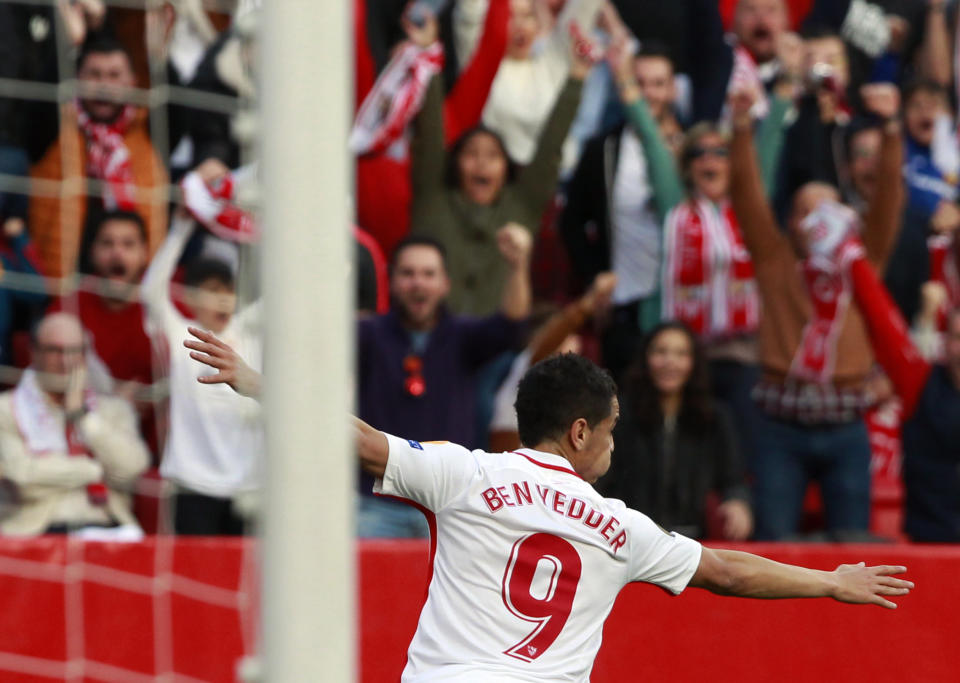 Sevilla's Wissam Ben Yedder celebrates after scoring his side's opening goal during the Europa League round of 32 second leg soccer match between Sevilla and Lazio at the Sanchez Pizjuan stadium, in Seville, Spain, Wednesday, Feb. 20, 2019. (AP Photo/Miguel Morenatti)