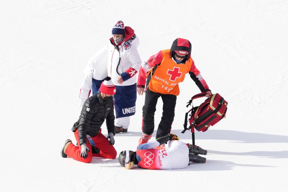 Nina O'Brien is attended to after she was injured in a crash during the women's giant slalom.