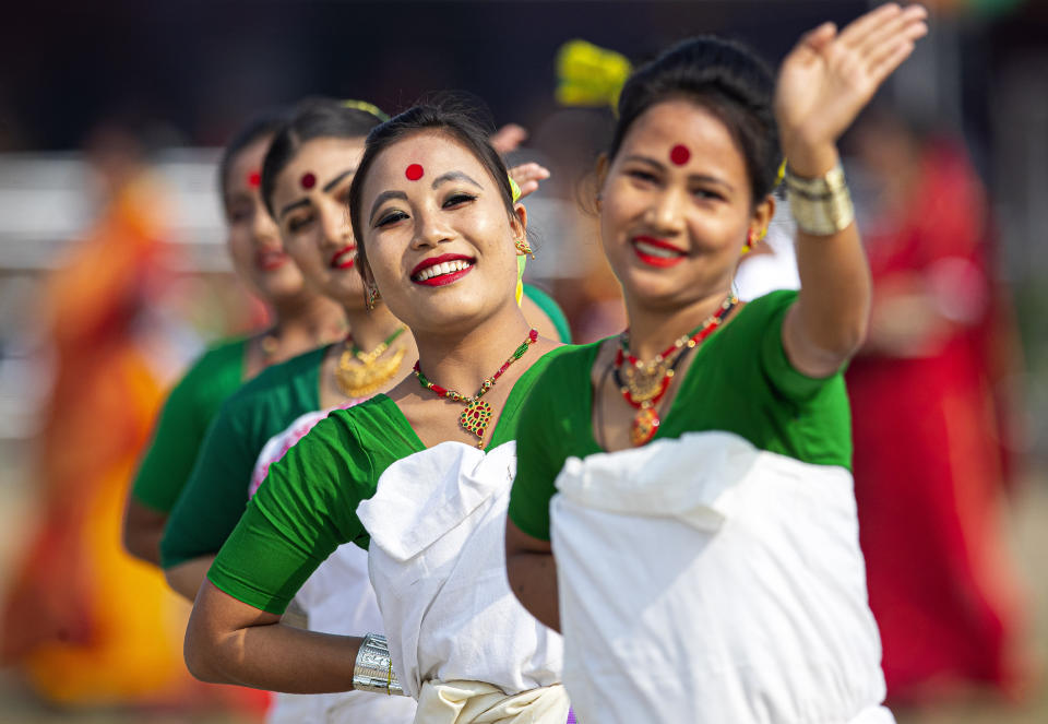 Indian tribal Deuri women in traditional attire perform to mark Republic Day in Gauhati, India, Sunday, Jan. 26, 2020. Sunday's event marks the anniversary of the country's democratic constitution taking force in 1950. (AP Photo/Anupam Nath)