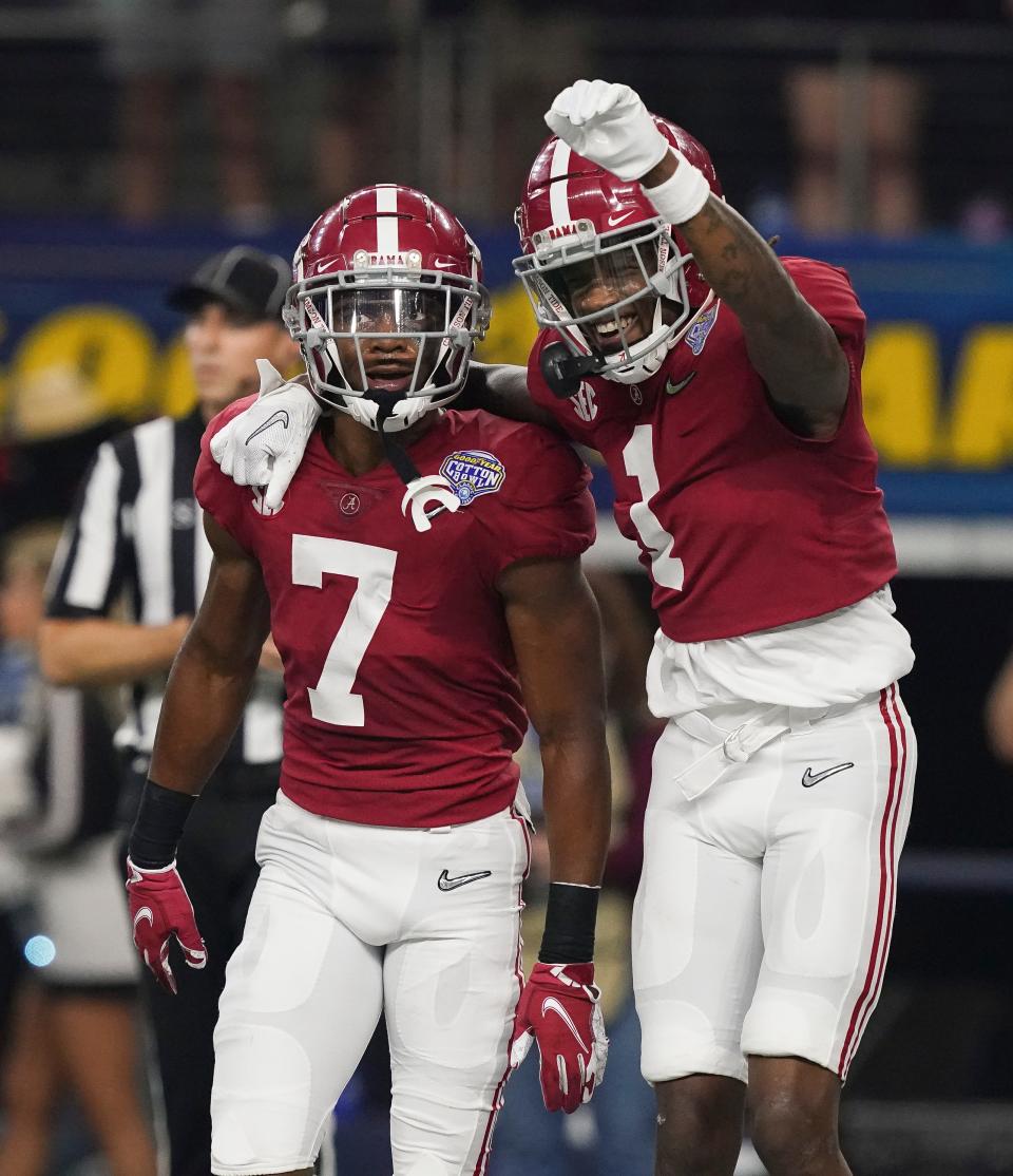 Alabama wide receiver Ja'Corey Brooks (7) and Alabama wide receiver Jameson Williams (1) celebrate after Brooks caught a touchdown pass against Cincinnati during the 2021 College Football Playoff Semifinal game at the 86th Cotton Bowl in AT&T Stadium in Arlington, Texas Friday, Dec. 31, 2021. [Staff Photo/Gary Cosby Jr.]