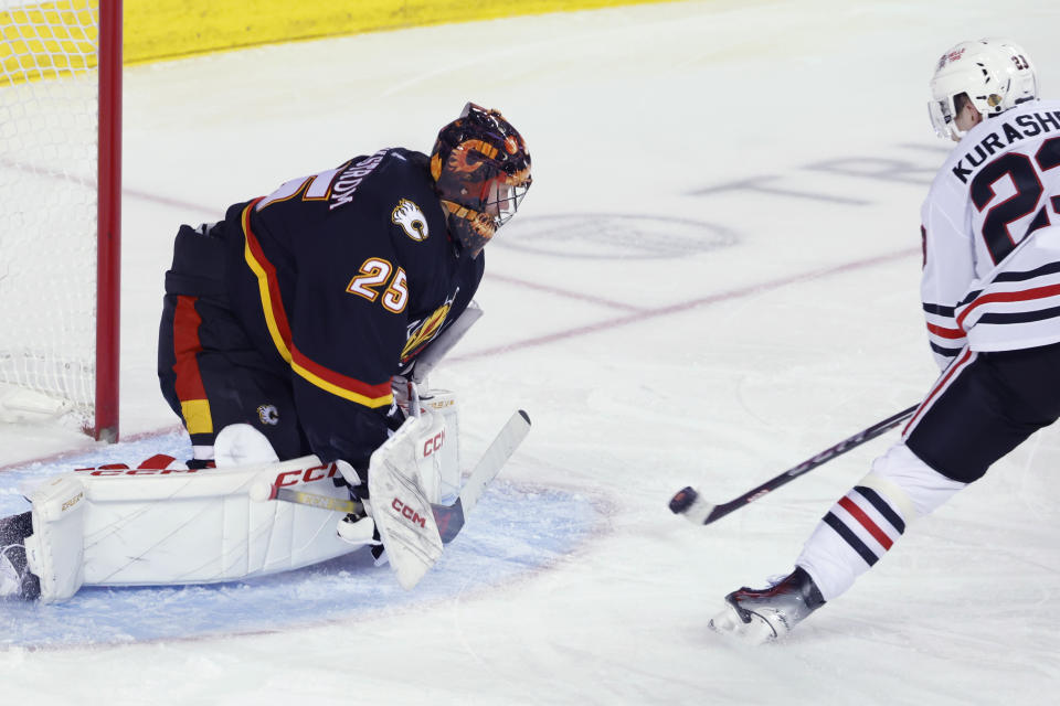 Calgary Flames goalie Jacob Markstrom, makes a save against Chicago Blackhawks' Philipp Kurashev during the second period of an NHL hockey game Saturday, Jan. 27, 2024, in Calgary, Alberta. (Larry MacDougal/The Canadian Press via AP)