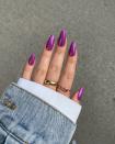 We're calling it now: This purple chrome mani is the Halloween-friendly evolution of <a href="https://www.glamour.com/gallery/barbie-nails?mbid=synd_yahoo_rss" rel="nofollow noopener" target="_blank" data-ylk="slk:Barbie nails;elm:context_link;itc:0;sec:content-canvas" class="link ">Barbie nails</a>.