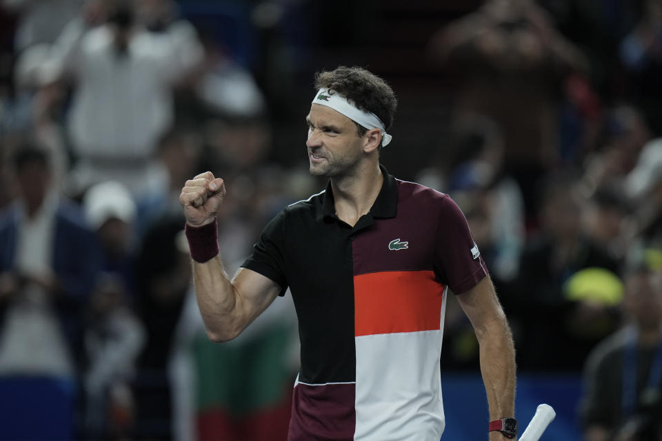 Grigor Dimitrov of Bulgaria reacts after defeating Nicolas Jarry of Chile in the men's singles quarterfinal match of the Shanghai Masters tennis tournament at Qizhong Forest Sports City Tennis Center in Shanghai, China, Friday, Oct. 13, 2023. (AP Photo/Andy Wong)