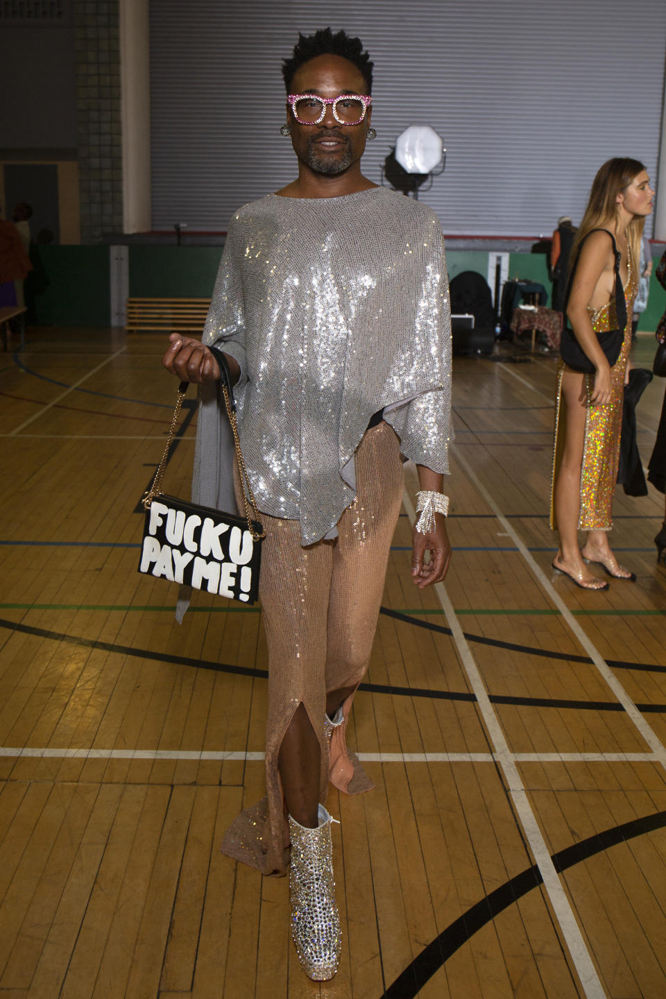 Billy Porter arrives at the Ashish show wearing glitter from head-to-toe and a statement bag on Sunday night [Photo: Getty Images]