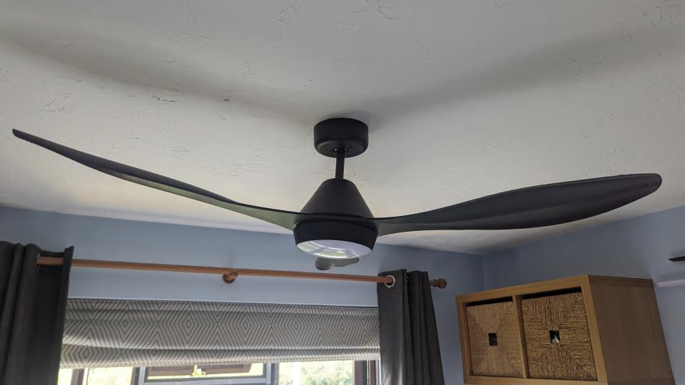 black ceiling fan ion blue walled room