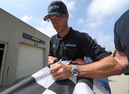 May 20, 2017; Indianapolis, IN, USA; IndyCar driver Sebastien Bourdais signs an autograph before qualifying for the 101st Running of the Indianapolis 500 at Indianapolis Motor Speedway. Thomas J. Russo-USA TODAY Sports
