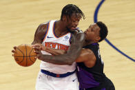 New York Knicks' Julius Randle, left, is guarded by Toronto Raptors' Kyle Lowry, right, during an NBA basketball game at Madison Square Garden, Sunday, April 11, 2021, in New York. (Rich Schultz/Pool Photo via AP)