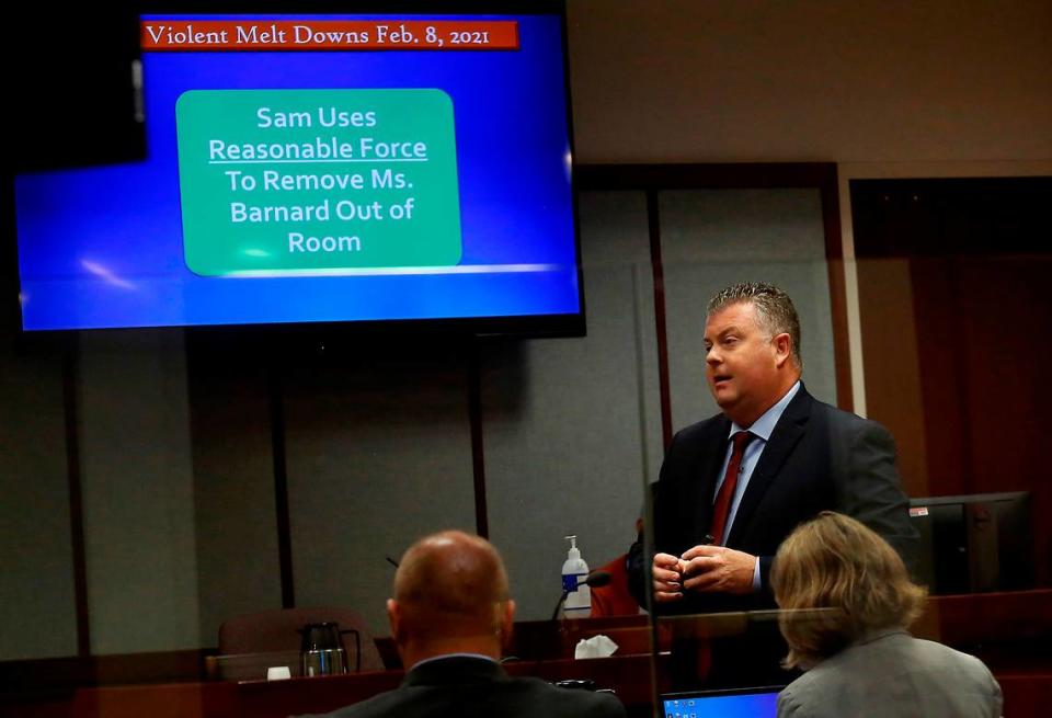 Defense attorney Scott Johnson uses computer presentation for his opening statement to the jury Tuesday morning during the domestic violence trial of Judge Sam Swanberg, a Benton-Franklin Superior Court judge. Yakima County District Court Judge Donald Engel is presiding at the trial being held in Franklin County.