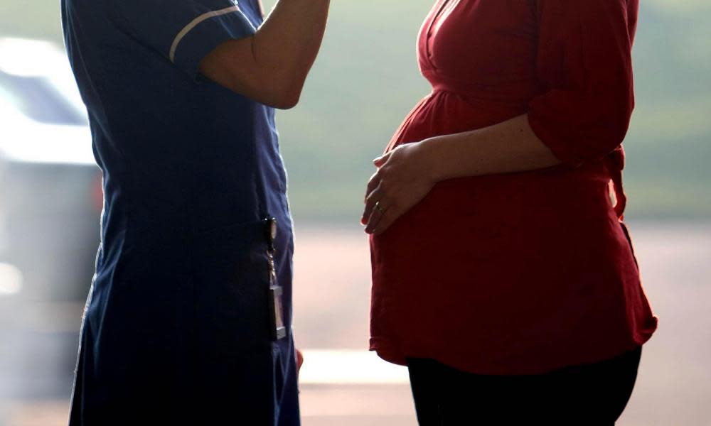 A midwife talking with a pregnant woman