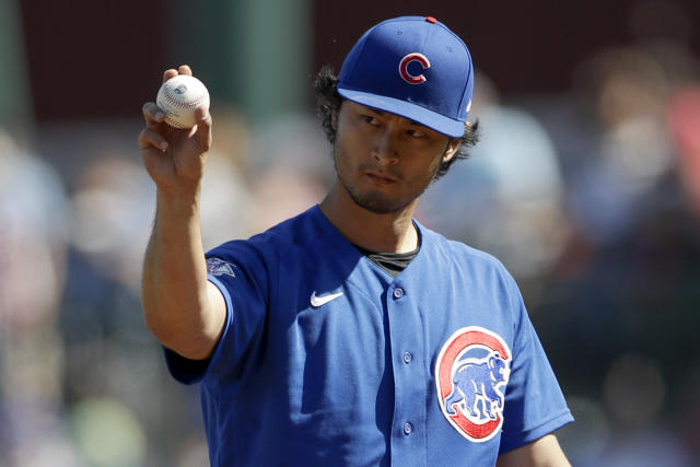 Chicago Cubs starting pitcher Yu Darvish works against a Milwaukee Brewers  batter during the first inning of a spring training baseball game Saturday,  Feb. 29, 2020, in Mesa, Ariz. (AP Photo/Gregory Bull