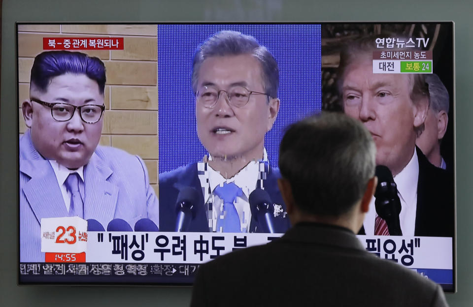 FILE - In this March 27, 2018 file photo, a man watches a TV screen showing file footages of U.S. President Donald Trump, right, South Korean President Moon Jae-in, center, and North Korean leader Kim Jong Un, left, during a news program at the Seoul Railway Station in Seoul, South Korea. The main focus of outside attention to this week’s inter-Korean summit is whether it can find ways to resolve the stalemated diplomacy on North Korea’s nuclear program. Also at stake is what steps the Koreas will take to lower decades-long military tensions and improve ties. (AP Photo/Lee Jin-man, File)