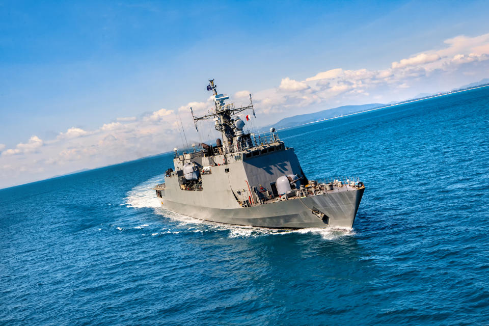 Military navy ships in a sea bay view from helicopter