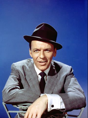 Michael Ochs Archives/Getty Frank Sinatra poses in a gray suit and fedora hat for a portrait, circa 1970.