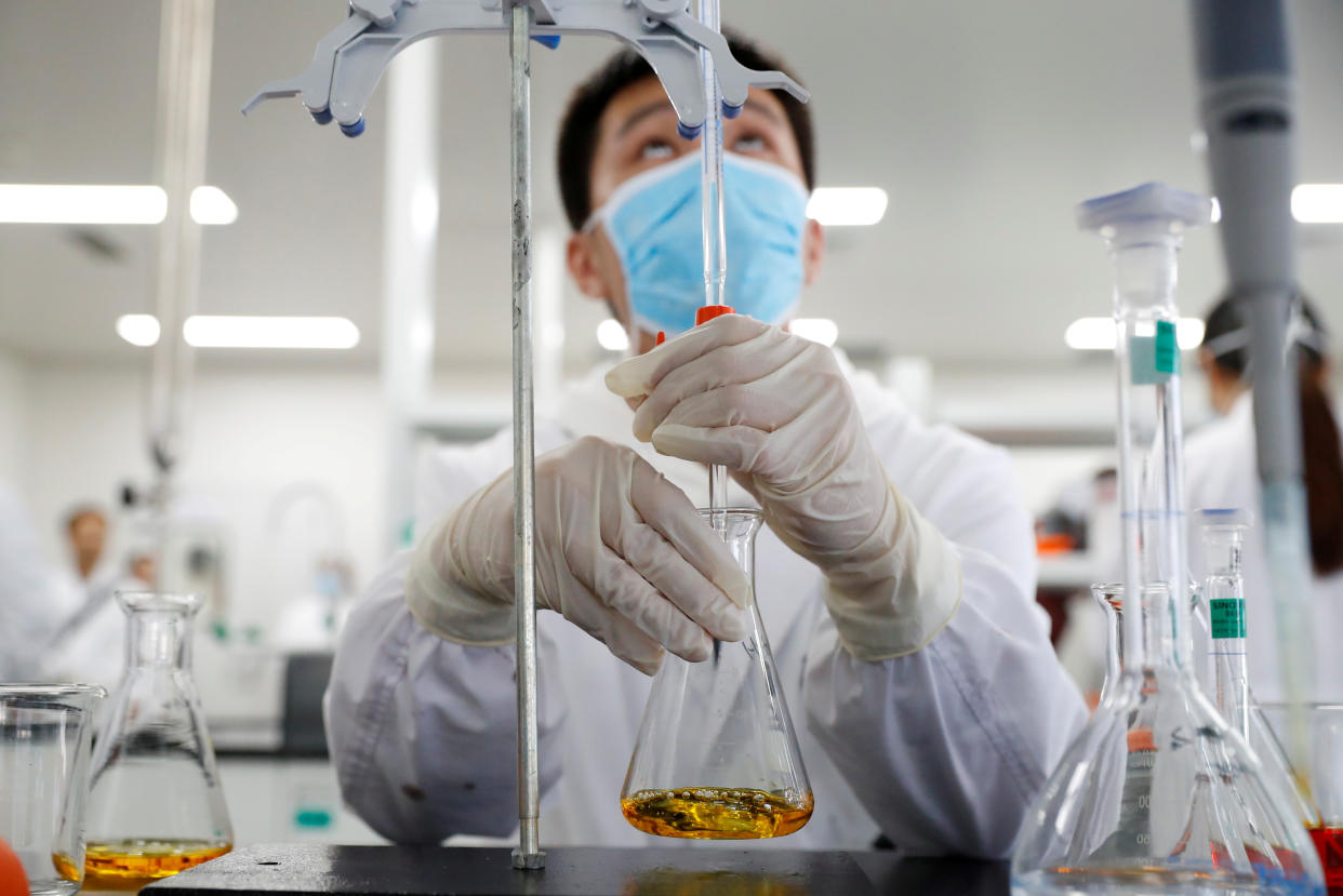 A man works in a laboratory of Chinese vaccine maker Sinovac Biotech, developing an experimental coronavirus disease (COVID-19) vaccine, during a government-organized media tour in Beijing, China, September 24, 2020. REUTERS/Thomas Peter     TPX IMAGES OF THE DAY