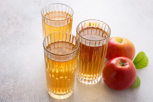 <p>Yulia Naumenko/Getty</p> stock photo of apple cider