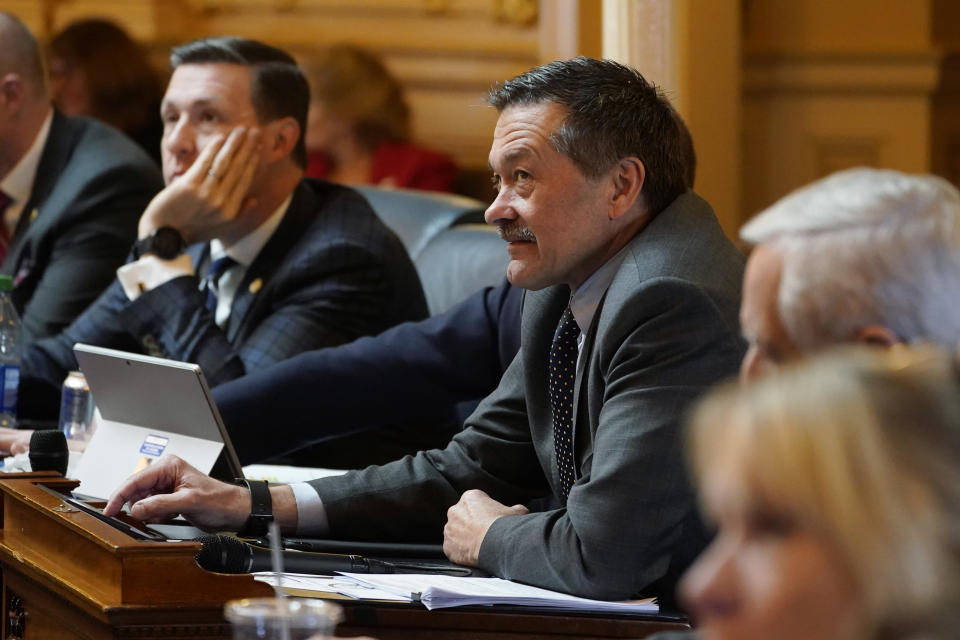 House majority leader Del. Terry Kilgore, R-Scott, center right, watches the vote tally board as the House passes an emergency amendment on the school mask bill during the House session at the Capitol Wednesday Feb. 16, 2022, in Richmond, Va. (AP Photo/Steve Helber)