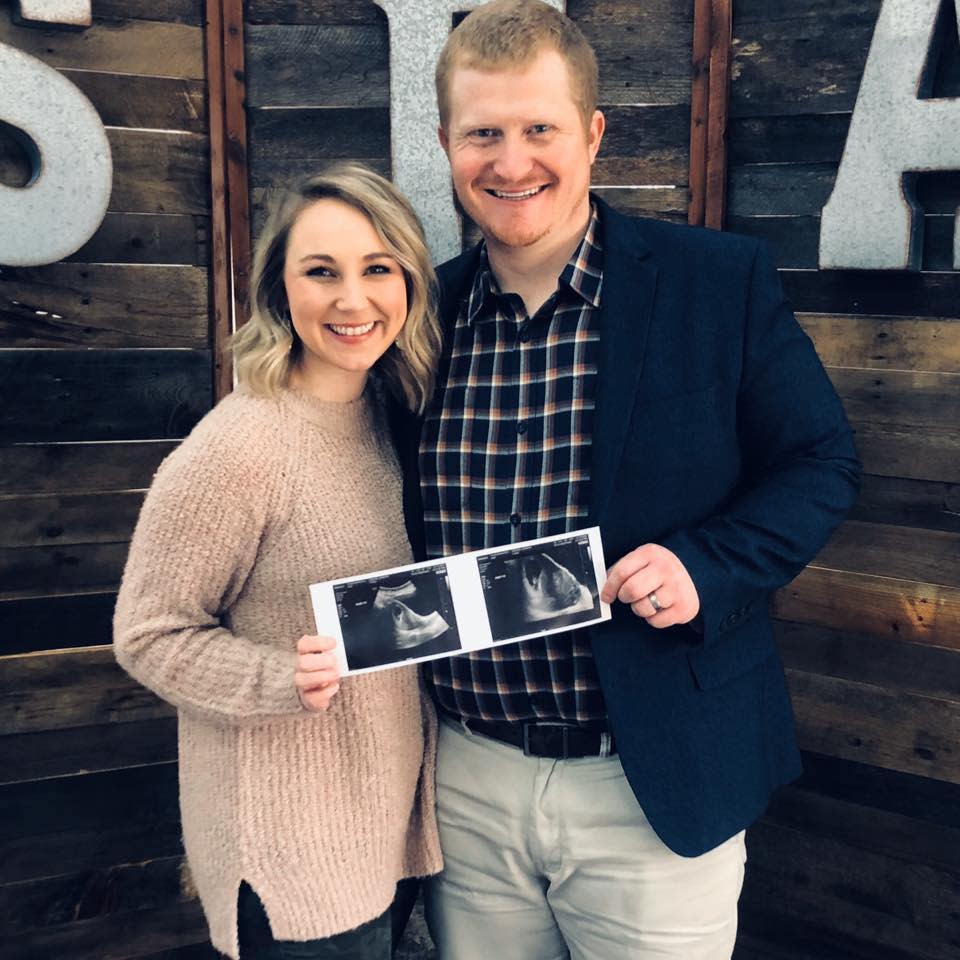 Jennifer and Dustin Sanders hold the sonogram of their daughter. (Photo: Dustin Sanders)