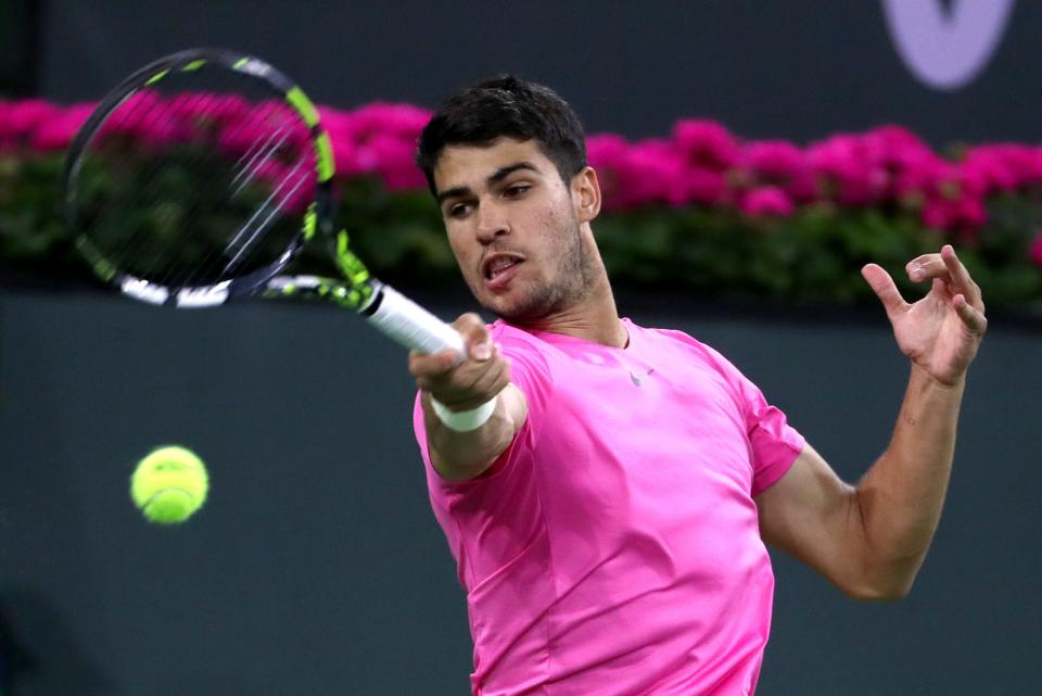 Carlos Alcaraz returns to Tallon Grieskpoor during the BNP Paribas Open in Indian Wells, Calif., on Monday, March 13, 2023. 