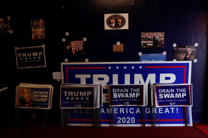 Campaign signs for U.S. President Donald Trump sit inside the Republican headquarters in Union City, Pennsylvania