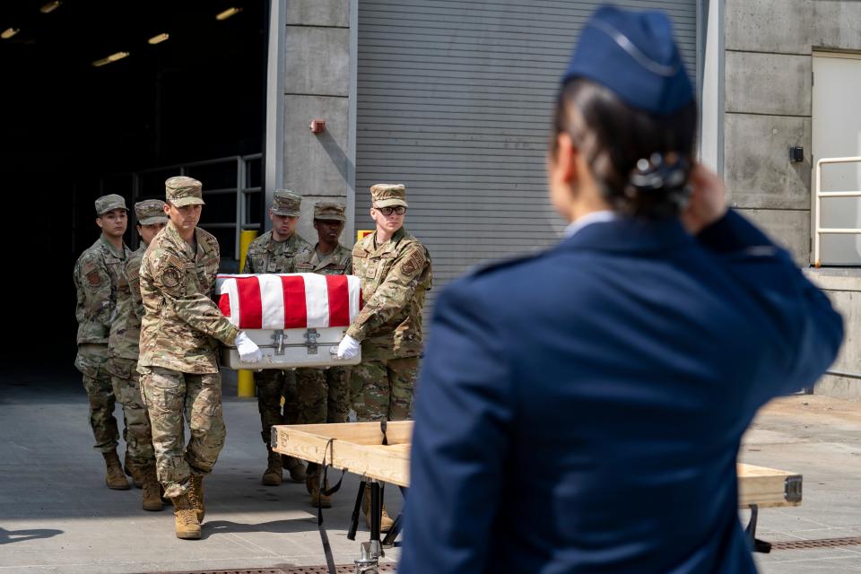 U.S. Air Force Airmen with the Joint Base Elmendorf-Richardson Honor Guard carry the transfer case of a service member recovered during Operation Colony Glacier at JBER, Alaska, June 26, 2022. The transfer cases will go to Dover Air Force Base, Delaware, for identification of remains and personal effects before being returned to families. Operation Colony Glacier is an effort to recover the remains of service members and wreckage from a 1952 flight which had 52 military members on board. As of June 2022, 47 of the 52 service members’ remains have been recovered and identified.