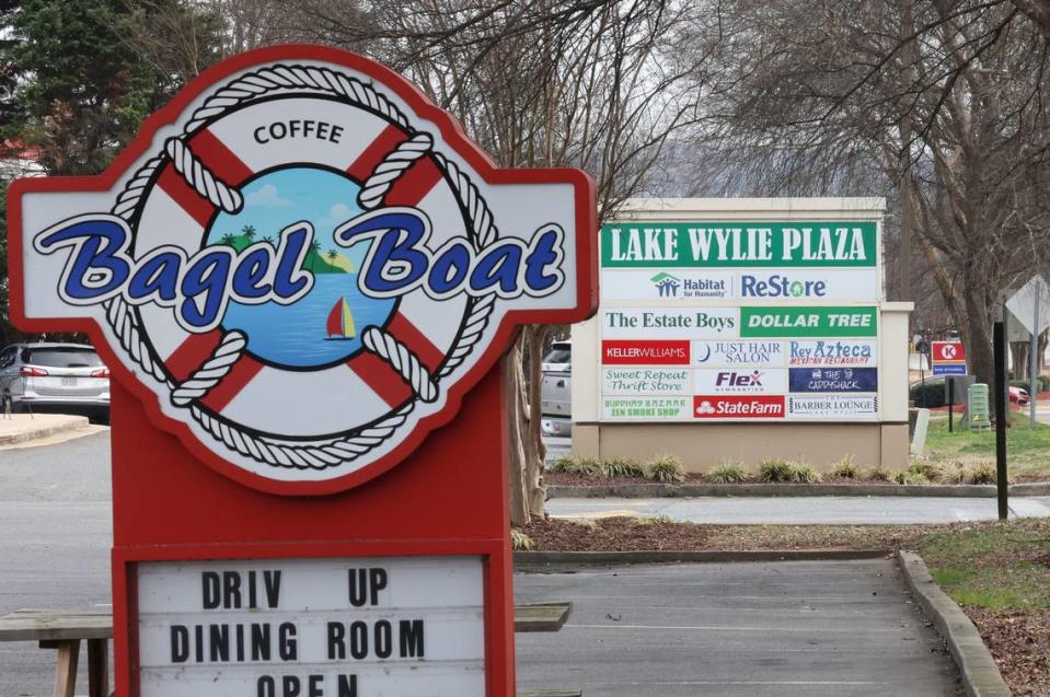 Lake Wylie businesses advertise their services, including a drive-through restaurant and a gas station. York County may change rules about where certain types of business can open in Lake Wylie, based on how close sites are to similar businesses.