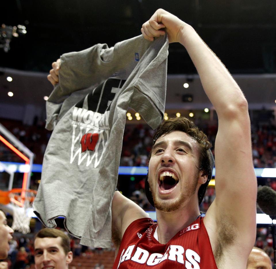 Wisconsin 's Frank Kaminsky celebrates after a regional final NCAA college basketball tournament game against Arizona, Saturday, March 29, 2014, in Anaheim, Calif. Wisconsin won 64-63 in overtime.
