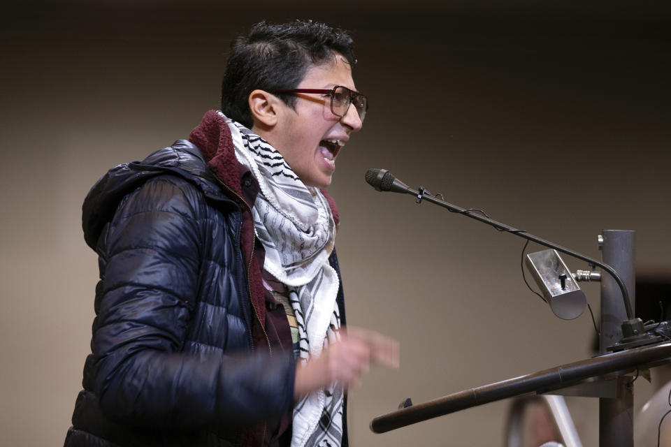 A woman speaks against the City Council resolution calling for an immediate cease-fire in Gaza, Monday, Nov. 27, 2023, in Oakland, Calif. (AP Photo/D. Ross Cameron)