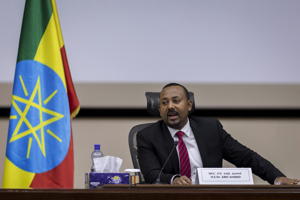 Ethiopia's Prime Minister Abiy Ahmed responds to questions from members of parliament at the prime minister's office in the capital Addis Ababa, Ethiopia Monday, Nov. 30, 2020. The fugitive leader of Ethiopia's defiant Tigray region on Monday called on Prime Minister Abiy Ahmed to withdraw troops from the region as he asserted that fighting continues "on every front" two days after Abiy declared victory. (AP Photo/Mulugeta Ayene)