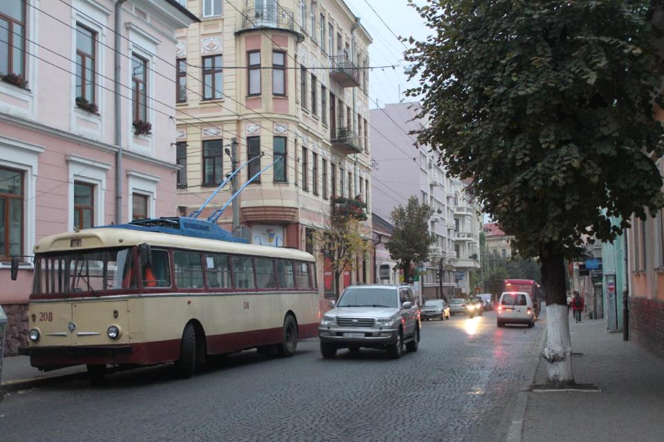 In this photo taken on Oct. 21 2012, an old trolley bus is parked on a central street in Chernivtsi, a city of 250,000 in southwestern Ukraine. Known as the Little Paris or, alternatively, the Little Vienna of Ukraine, Chernivtsi is a perfect place for a quiet romantic weekend trip and a crash course in the painful history of Europe in the 20th century. (AP Photo/Maria Danilova)