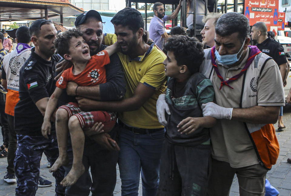 Wounded Palestinian children arrive to al-Shifa hospital, following Israeli airstrikes on Gaza City, central Gaza Strip, Tuesday, Oct. 17, 2023. (AP Photo/Abed Khaled)