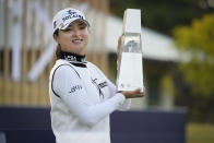 Jin Young Ko of South Korea displays the trophy after winning the final round of the BMW Ladies Championship at LPGA International Busan in Busan, South Korea, Sunday, Oct. 24, 2021. (AP Photo/Lee Jin-man)