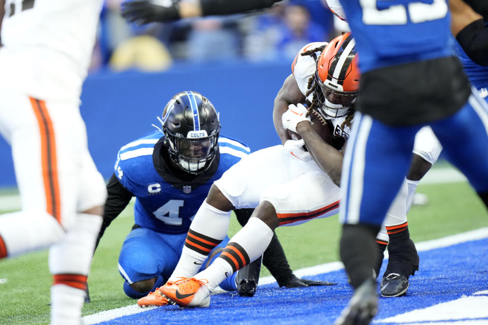 Cleveland Browns running back Kareem Hunt scores on a 2-yard touchdown run ahead of Indianapolis Colts linebacker Zaire Franklin (44) during the first half of an NFL football game, Sunday, Oct. 22, 2023, in Indianapolis. (AP Photo/AJ Mast)