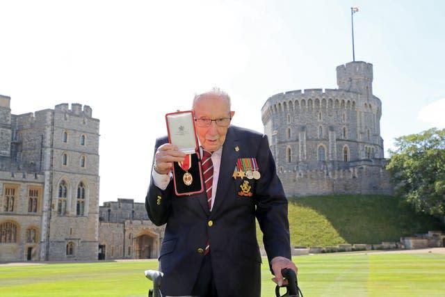 Sir Tom holding the insignia of his knighthood. Chris Jackson/PA Wire