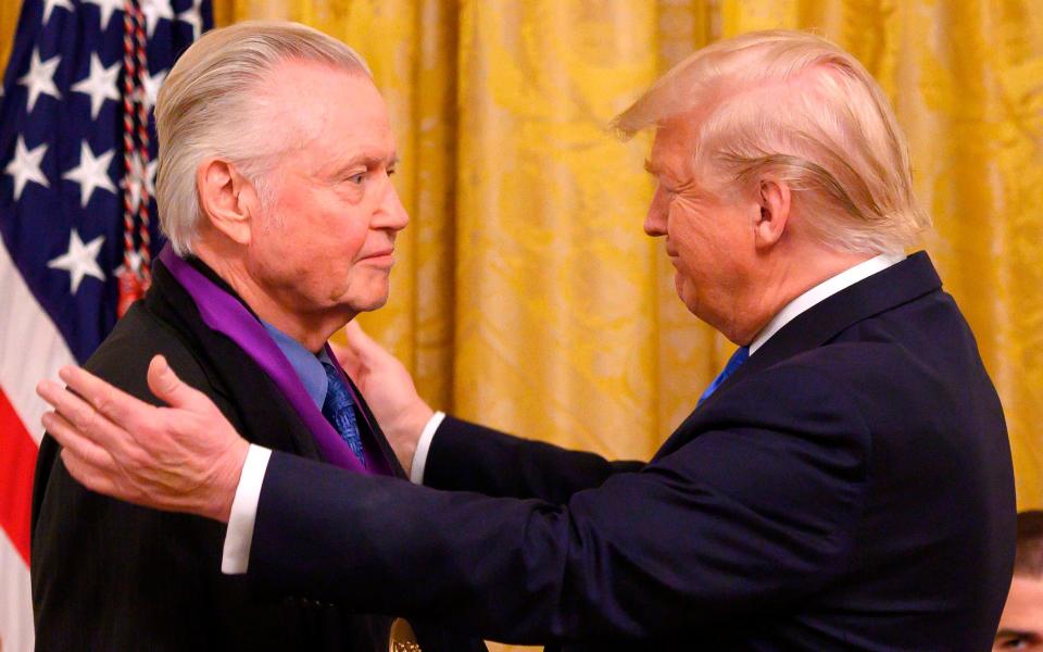 Jon Voight receives the National Medal of Arts from US President Donald Trump in 2019 - AFP