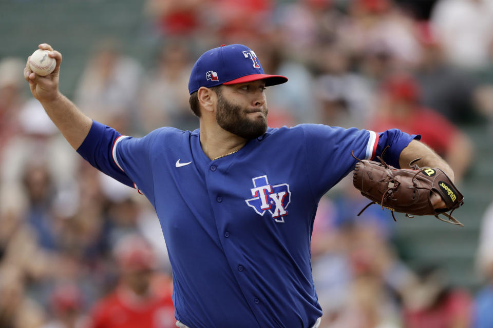 FILE - In this Feb. 28, 2020, file photo, Texas Rangers starting pitcher Lance Lynn throws during the first inning of a spring training baseball game against the Los Angeles Angels, in Tempe, Ariz. (AP Photo/Charlie Riedel, File)