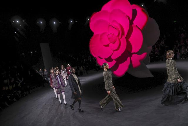 Chanel's camellias, empty chairs close Paris Fashion Week