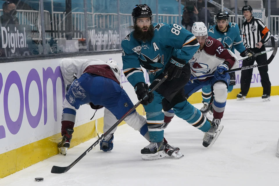 San Jose Sharks defenseman Brent Burns (88) reaches for the puck against the Colorado Avalanche during the second period of an NHL hockey game in San Jose, Calif., Monday, May 3, 2021. (AP Photo/Jeff Chiu)