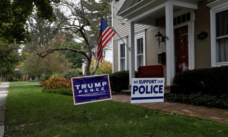 A home bears signs supporting Donald Trump.