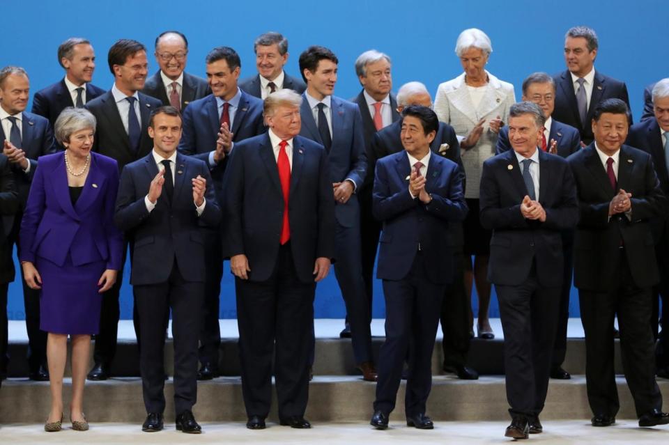 Donald Trump poses in the G20 photo with other world leaders (AP)