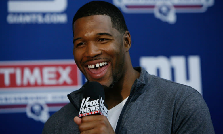 Michael Strahan speaking to the media.