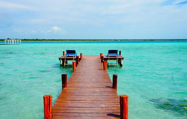 Swim the crystal blue waters Laguna Balacar, just two hours from Tulum. Photo: Erin Van Der Meer