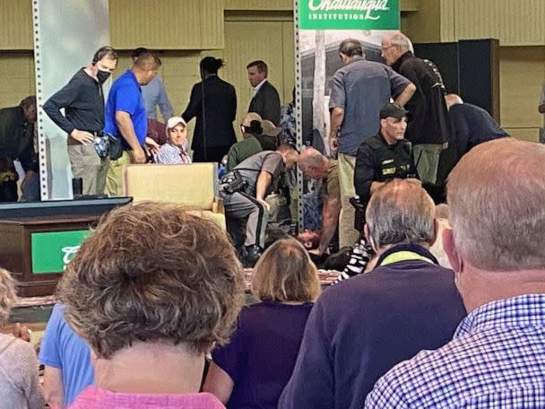 PHOTO: A view of who appears to be author Salman Rushdie treated by emergency personnel after being stabbed on stage before a scheduled speech at the Chautauqua Institution in Chautauqua, N.Y., Aug. 12, 2022, is seen in an image obtained from social media (Mary Newsom via Reuters)