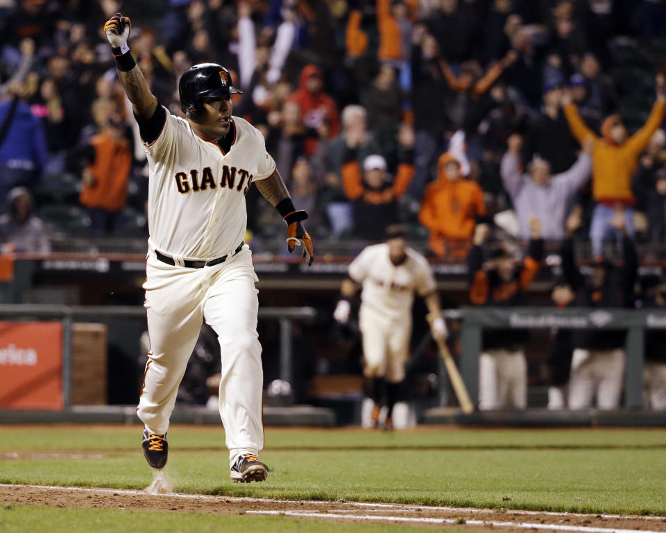 San Francisco Giants' Hector Sanchez runs down the first base line after driving in the game-winning run during the 12th inning of a baseball game against the Los Angeles Dodgers on Wednesday, April 16, 2014, in San Francisco. San Francisco won 3-2. (AP Photo/Marcio Jose Sanchez)
