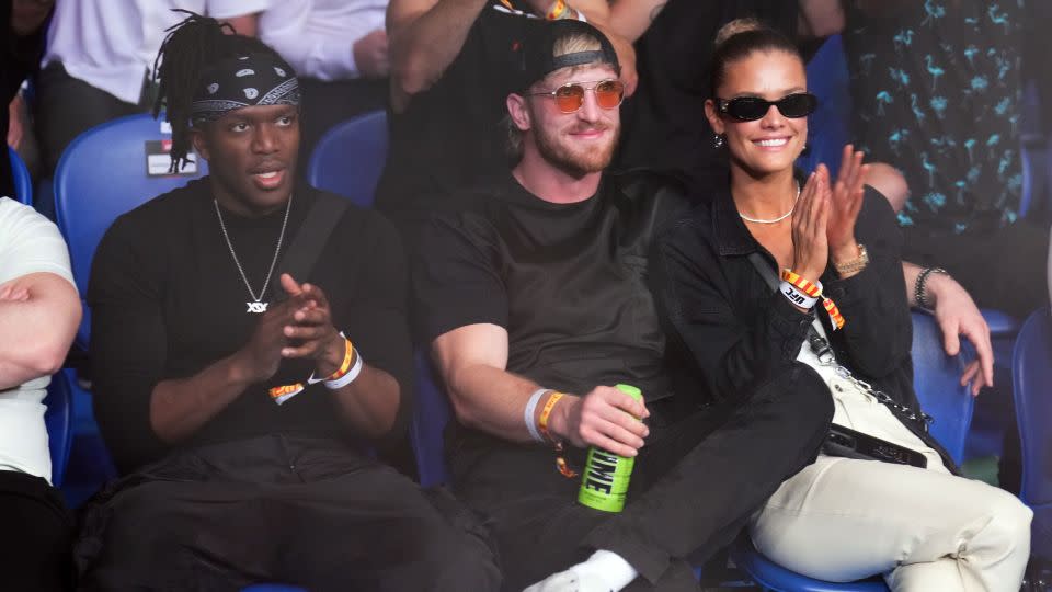 Logan Paul (middle) and Nina Agdal (right) attend the UFC 284 event at RAC Arena on February 12, 2023 in Perth, Australia, alongside KSI (left). - Chris Unger/Zuffa LLC/Getty Images