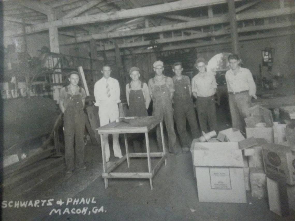 In a 1935 photo, employees and owners of L.E. Schwartz stand for a photo. The business recently celebrated 114 since opening in Macon.